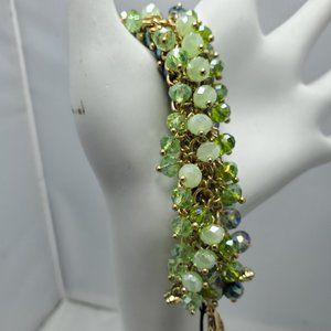 Ali Khan beaded bracelet with gold links. color aqua-green-seagrass beads